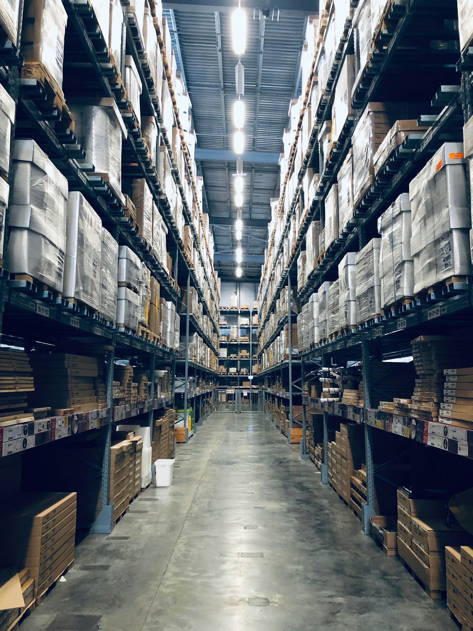 Illustrative photograph of a warehouse aisle. Not a 419 project.