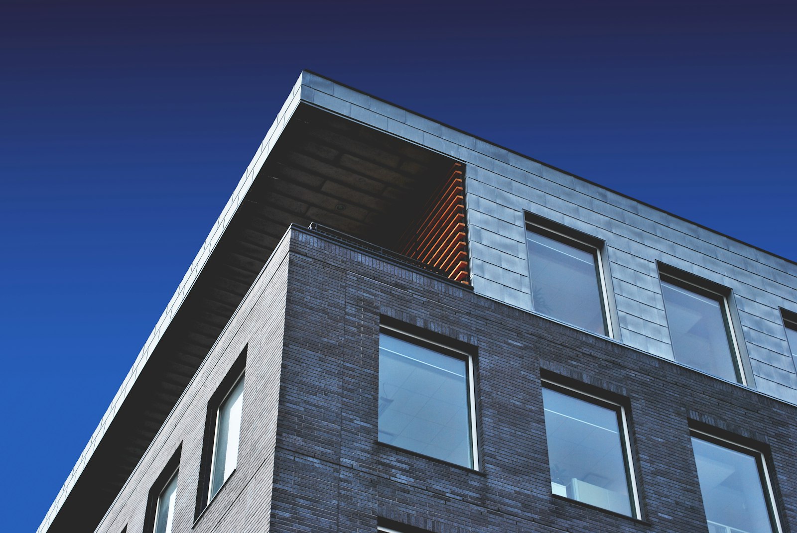 Illustrative photograph of a commercial brick and metal facade. Not a 419 project.